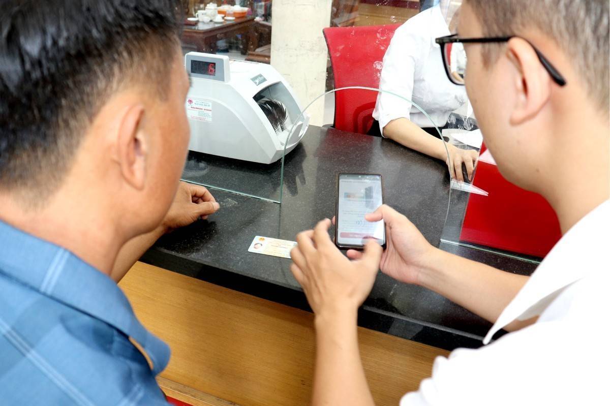 Hà Nội đề xuất hỗ trợ chi phí chi trả an sinh xã hội không dùng tiền mặt