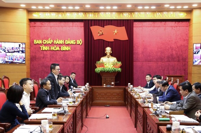 Đồng ch&amp;iacute; L&amp;ecirc; Quốc Minh, Tổng bi&amp;ecirc;n tập B&amp;aacute;o Nh&amp;acirc;n d&amp;acirc;n ph&amp;aacute;t biểu tại buổi l&amp;agrave;m việc.